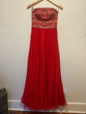 Red bejeweled prom dress